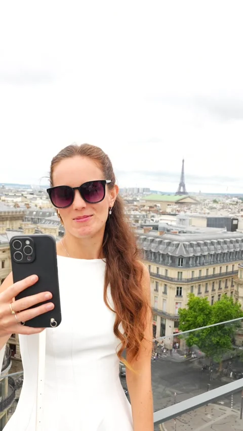 Woman live streaming with Eiffel Tower view in Paris Stock Footage 314980187