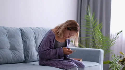 Woman looking and using smart phone with scoliosis, side view. Incorrect posture Stock Footage 137933226