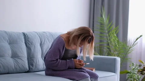 Woman looking and using smart phone with scoliosis, side view. Incorrect posture Stock Footage 138011167