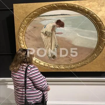 Woman looking at art Stock Photos