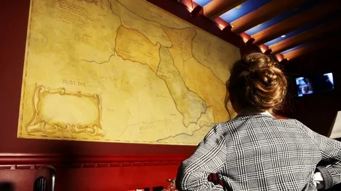 A woman is looking at a big map Video stock 99136653