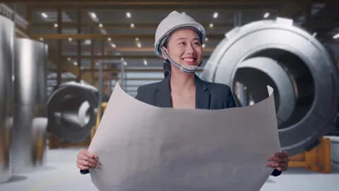 Woman Looking At Blueprint While Walking at Heavy Factory Stock Footage 340814158