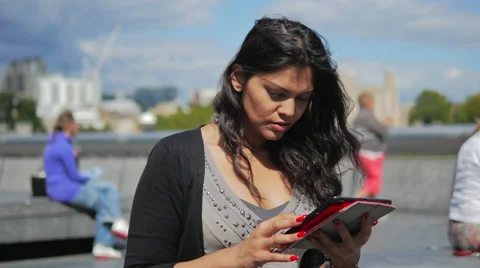 Woman Looking Browsing a Digital Tablet, with City of London in the Backgroun Stock Footage 41214932