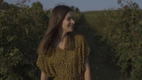 Woman Looking At Camera And Smiling At Vineyard. Close-Up Stock Footage 116419033