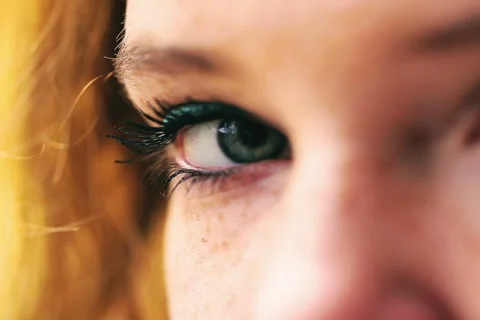 Woman looking to the camera, closeup Видео 44789145