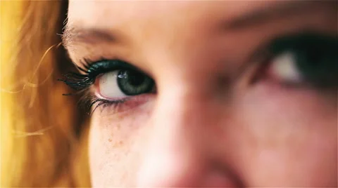 Woman looking to the camera, closeup Видео 44791013