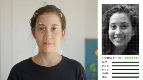 Woman looking at camera with face detection and recognition algorithm applied Video stock 301981037