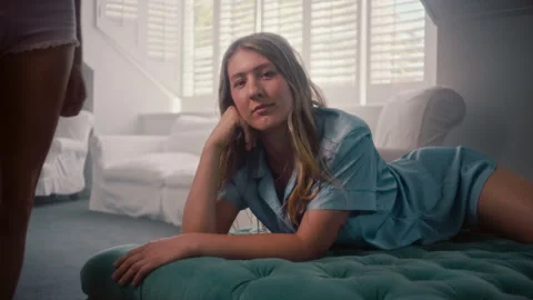 Woman Looking At Camera while Lying and Relaxing Stock Footage 279173350