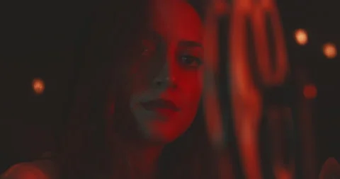 Woman looking at the camera while using a projector Stock Footage 203592649