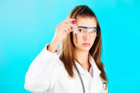 Woman looking at the chemical tube Stock Photos