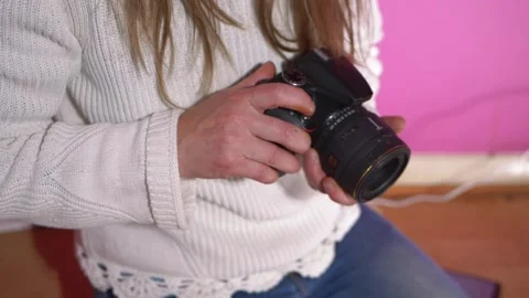 Woman looking at digital camera Stock Footage 155303141