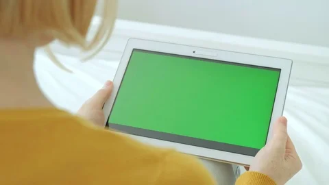 Woman looking at digital tablet computer with green screen chroma key. Stock Footage 94142463