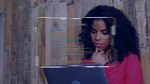 Woman looking down, causing translucent HUD with scrolling code appearing over Stock-Footage 335235957