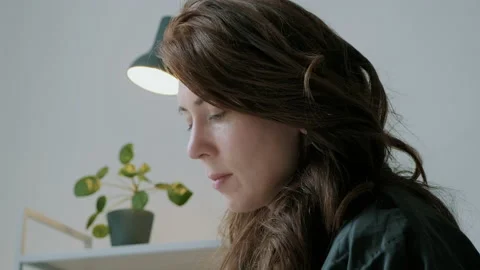 Woman looking down reading Stock Footage 130647924