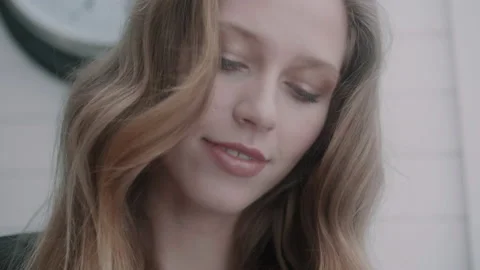 Woman looking down while smiling Video stock 131042835