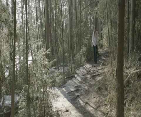 Woman looking down while walking in the forest Stock Footage 110367869