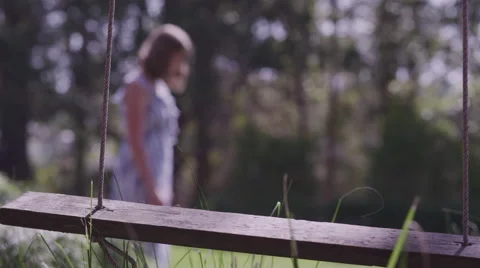 Woman Looking At Empty Swing Stock Footage 68720458