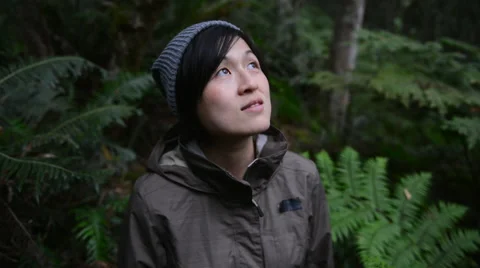 Woman looking up at forest Stock Footage 53084228