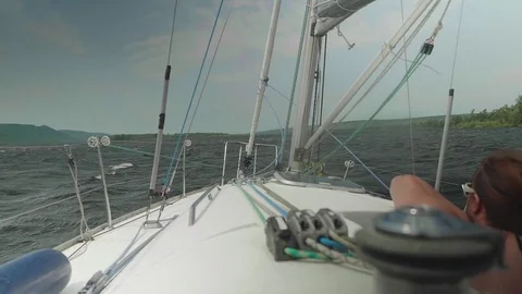 Woman looking forward from sailing boat during a storm Stock Footage