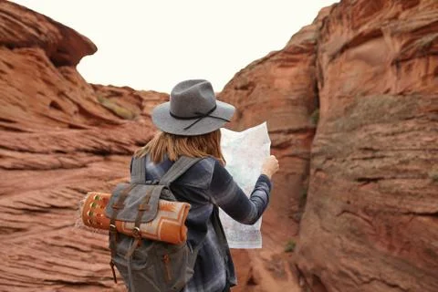 Woman looking at map, rear view, Page, Arizona, USA Stock Photos
