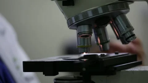 Woman looking into microscope 4 Stock Footage 41416413