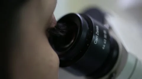 Woman looking into microscope Video stock 41415485