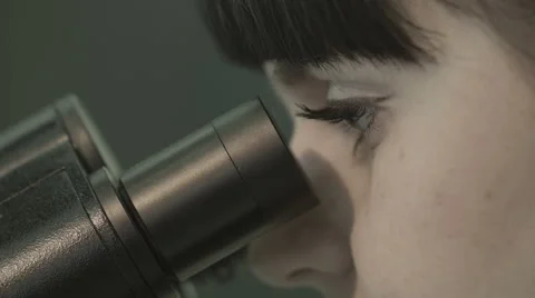 Woman looking into microscope Stock Footage 42755898