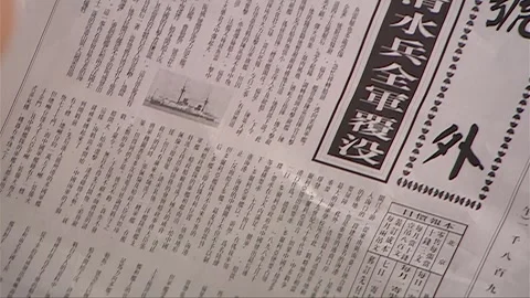 The woman is looking at a newspaper with missing content Stock Footage 276517006