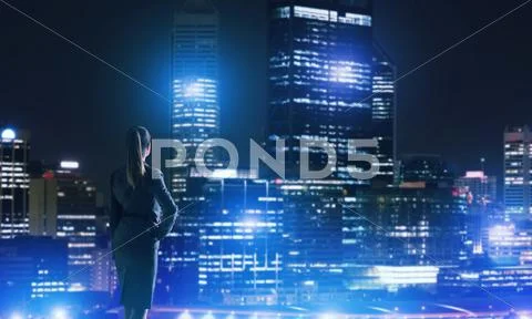 Woman looking at night city Stock Photos