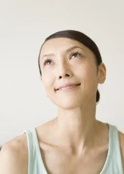A woman looking up Stock Photos