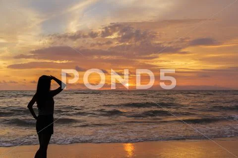 Woman looking in the sunset Stock Photos