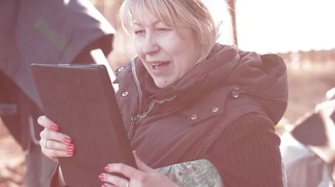 Woman looking into the tablet computer emotionally Stock Footage 37763932