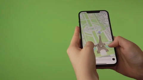 Woman looking at th Eifffel Tower on 3D map on phone Stock Footage 251863246