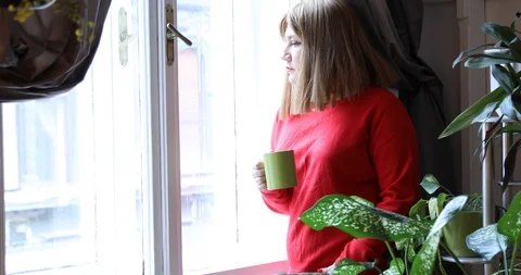 Woman looking through a window 2 Stock Footage 101858628