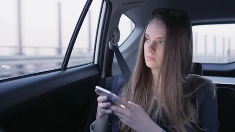Woman Looking Through the Window in the Car and Smiling Stock Footage 75682009