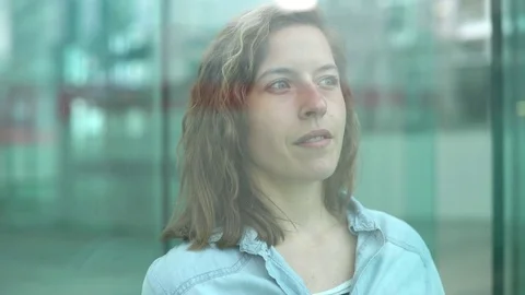 Woman looking through window Stock Footage 75171811
