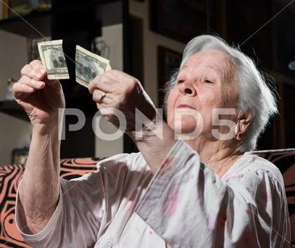 Woman looking at torn one hundred dollar bill Stock Photos