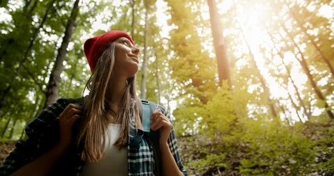 Woman Looking up on Trees in Forest Backpack 動画素材 115286806