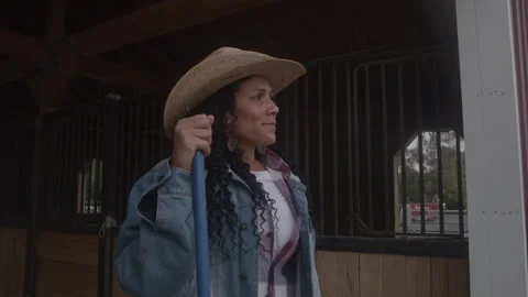Woman Looking at the View While Standing in Barn During Daytime Видео 270323408