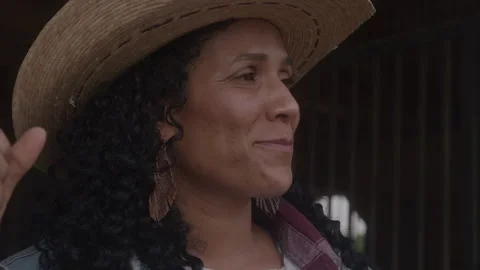 Woman Looking at the View While Standing in Barn During Daytime Stock Footage 270323451