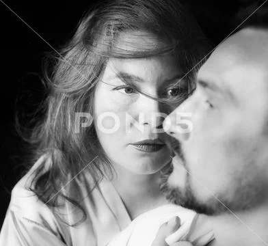 Woman looks at man with love, indoor Stock Photos