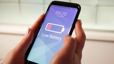 Woman With a Low Battery Smartphone Needing Charging