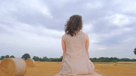 Woman lying and relaxing on haystack 스톡 동영상 101016296