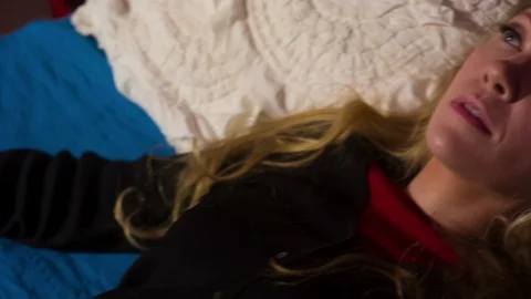 Woman lying on a bed Video stock 105861007