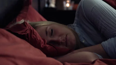 Woman lying in bed sleeping. Stock Footage 42175169