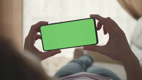 Woman Lying on Couch Using Smartphone With Chroma Key Green Screen Scrollin.. Stock Footage 302680097