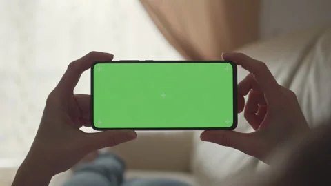 Woman Lying on Couch Using Smartphone With Chroma Key Green Screen Scrollin.. Stock Footage 327394477