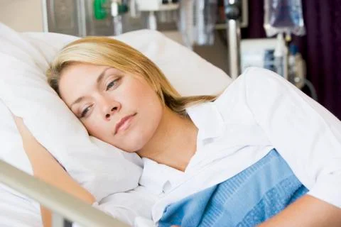 Woman Lying Down In Hospital Bed Stock Photos