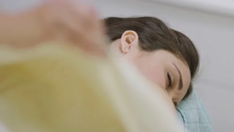 Woman lying down while getting a massage at a spa Stock Footage 138064422