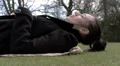 Woman lying on grass in the park HD Footage